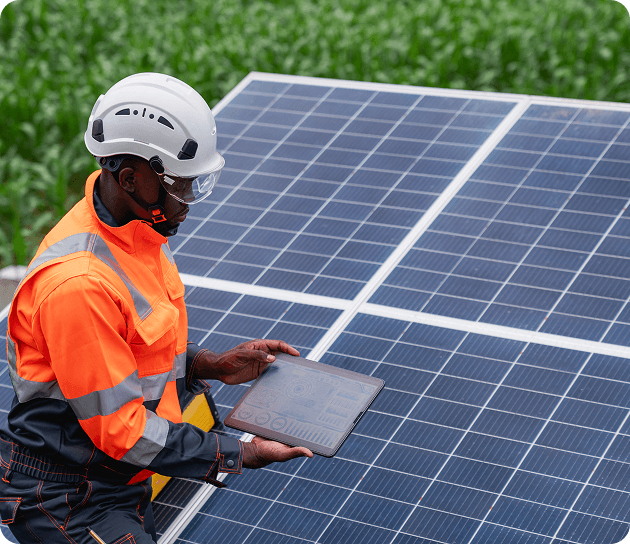 Engineer working beside solar panels